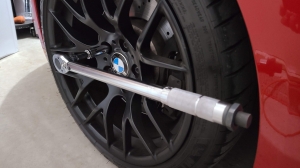 Why is torqueing lug nuts correctly so important to wheel integrity and safety?